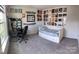 Bedroom featuring a daybed, wall decor, and a desk with a computer setup at 6499 Gopher Rd, Lancaster, SC 29720
