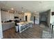 Modern kitchen features a large island with seating, stainless steel appliances, and ample cabinet space at 6499 Gopher Rd, Lancaster, SC 29720