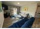 Cozy living room with stylish decor, a large area rug, and sliding glass doors at 6499 Gopher Rd, Lancaster, SC 29720