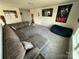 Spacious living room featuring a large sectional sofa, a TV, and neutral decor at 6499 Gopher Rd, Lancaster, SC 29720