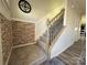 Inviting stairway with modern railing, plush carpet, and charming accent wall at 6499 Gopher Rd, Lancaster, SC 29720