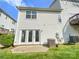 Exterior of home showcasing back patio, siding, and well-maintained lawn at 6525 Soapstone Dr, Charlotte, NC 28269
