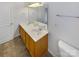 Bright bathroom with double sink vanity, white countertops, and tile flooring at 6525 Soapstone Dr, Charlotte, NC 28269