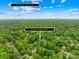 Overhead shot of property with trees and address, showing proximity to Uptown Charlotte at 6744 Wheeler Dr, Charlotte, NC 28211