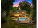 Beautiful backyard with pool, patio, deck and outdoor kitchen - perfect for entertaining at 6744 Wheeler Dr, Charlotte, NC 28211