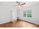 Bedroom with light hardwood floors and attached office space at 6744 Wheeler Dr, Charlotte, NC 28211