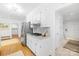 Modern kitchen with stainless steel refrigerator, granite countertops, and gas cooktop at 6744 Wheeler Dr, Charlotte, NC 28211