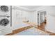 Laundry room with washer/dryer and wire rack shelving at 6744 Wheeler Dr, Charlotte, NC 28211
