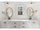 Bathroom with double sinks, granite countertops and framed mirrors at 7205 Church Rd, Taylorsville, NC 28681