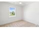 Bright bedroom with a ceiling fan and a window with a view of the outdoors at 7205 Church Rd, Taylorsville, NC 28681