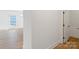 Bright hallway showcasing wood-look floors and white trim at 7205 Church Rd, Taylorsville, NC 28681