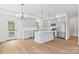 Modern kitchen featuring gray cabinets, quartz countertops, stainless appliances and island at 7205 Church Rd, Taylorsville, NC 28681