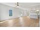 Open-concept living room with light wood floors and lots of natural light at 7205 Church Rd, Taylorsville, NC 28681