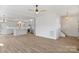 Spacious living room open to the kitchen with modern appliances and light wood floors at 7205 Church Rd, Taylorsville, NC 28681