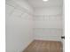 Spacious walk-in closet featuring ample shelving space and neutral carpet at 7205 Church Rd, Taylorsville, NC 28681