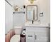 Charming bathroom with a vanity, framed mirror, modern fixtures, and toilet at 7324 Swans Run Rd, Charlotte, NC 28226