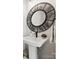 Elegant powder room features a pedestal sink with a decorative mirror and stylish fixtures at 7324 Swans Run Rd, Charlotte, NC 28226