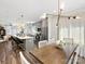 Open concept kitchen and dining area with stainless steel appliances and island with bar seating at 7324 Swans Run Rd, Charlotte, NC 28226