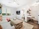 Bright living room featuring a workstation, modern lighting, and seamless flow to the adjacent bathroom at 7324 Swans Run Rd, Charlotte, NC 28226