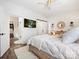Primary bedroom with ceiling fan, en-suite bathroom, walk-in closet and contemporary decor at 7324 Swans Run Rd, Charlotte, NC 28226
