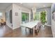 Cozy dining room with sliding glass doors, modern light fixture, and view to the patio at 7518 Porrera St, Charlotte, NC 28214
