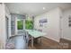 Bright dining area featuring a glass-top table, stylish chairs, and natural light at 7518 Porrera St, Charlotte, NC 28214