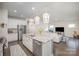 Well-appointed kitchen with granite counters, stainless appliances, and an open layout to the living area at 7518 Porrera St, Charlotte, NC 28214