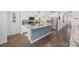 Bright kitchen boasts a large island, stainless appliances, pendant lighting, and a modern design at 7518 Porrera St, Charlotte, NC 28214