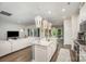 Stylish kitchen with a granite island, stainless steel appliances, and open views to the living room at 7518 Porrera St, Charlotte, NC 28214