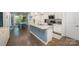 Modern kitchen with granite countertops and stainless steel appliances, open to the dining area at 7518 Porrera St, Charlotte, NC 28214
