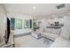 Spacious living room flows into the dining area, showcasing hardwood floors and stylish decor at 7518 Porrera St, Charlotte, NC 28214