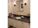 Stylish powder room with updated lighting, granite counters, and contemporary mirror at 815 21St Avenue Nw Dr, Hickory, NC 28601