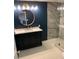Elegant bathroom featuring modern vanity with a round mirror and luxurious marble tile shower at 815 21St Avenue Nw Dr, Hickory, NC 28601