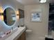 Elegant bathroom featuring a modern vanity, stylish lighting, and a window at 815 21St Avenue Nw Dr, Hickory, NC 28601