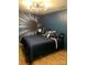 Stylish bedroom featuring a geometric accent wall, wood floors, and blue bedding at 815 21St Avenue Nw Dr, Hickory, NC 28601