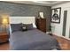 This primary bedroom includes luxury finishes like modern wall decor and decorative pillows at 815 21St Avenue Nw Dr, Hickory, NC 28601