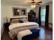 This bedroom features a luxurious king bed, decorative artwork, and dark wood furniture at 815 21St Avenue Nw Dr, Hickory, NC 28601