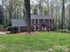 Beautifully landscaped two-story brick home with manicured lawn at 815 21St Avenue Nw Dr, Hickory, NC 28601