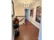 Charming hallway with wood floors, staircase, modern lighting, and decorative floral artwork at 815 21St Avenue Nw Dr, Hickory, NC 28601
