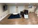 Cozy living area with hardwood floors and comfortable seating on a stylish blue rug at 815 21St Avenue Nw Dr, Hickory, NC 28601