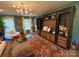 Open living room featuring built-in shelving, modern lighting, and stylish furnishings at 815 21St Avenue Nw Dr, Hickory, NC 28601