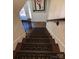 Looking down a staircase with wood treads, decorative risers and paneled walls at 815 21St Avenue Nw Dr, Hickory, NC 28601