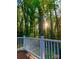 Inviting outdoor view from deck with a lush, wooded backdrop and bright sunlight at 815 21St Avenue Nw Dr, Hickory, NC 28601