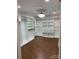 Spacious walk-in closet with custom shelving, drawers, and modern lighting at 815 21St Avenue Nw Dr, Hickory, NC 28601