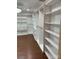 Large walk-in closet with custom shelving and cabinets at 815 21St Avenue Nw Dr, Hickory, NC 28601