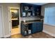 Charming wet bar with custom built-in cabinets and a view into the bathroom at 815 21St Avenue Nw Dr, Hickory, NC 28601