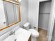 Clean bathroom featuring a vanity, toilet, and mirrored cabinet for storage at 827 Ford Dr, Lowell, NC 28098