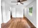 Bedroom boasting hardwood floors, a ceiling fan, and a bright window at 827 Ford Dr, Lowell, NC 28098