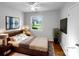 Cozy bedroom with natural light, modern decor, and hardwood flooring at 827 Ford Dr, Lowell, NC 28098