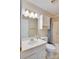 Well-lit bathroom with a single sink vanity and cabinet for storage at 904 Sunbeam Dr, Lincolnton, NC 28092
